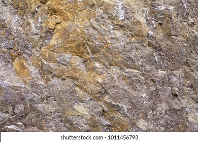 Granular limestone rock surface. Roe stone rock surface. Limestone crag texture. Roe-stone crag face. Limestone stone surface desktop pattern. Calcite crag idle screen. Calcspar reef desktop backdrop