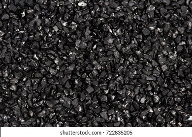 Granulated activated carbon on white background