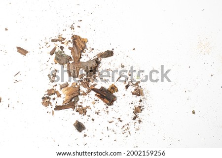 Granulated bark small wood pieces, crushed tree bark remains macro shot, isolated on white background