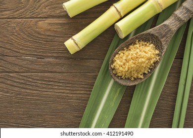granulated brown sugar produced from sugar cane, top view. Agriculture Industry concept. - Shutterstock ID 412191490