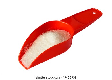 Granulated sugar in a small scoop. Isolated on a white background.