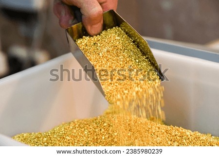 Granules of 99.99 percent pure gold in a workroom at a precious metals refining plant in Russia.