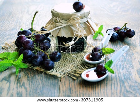 grape jam on a wooden background,homemade