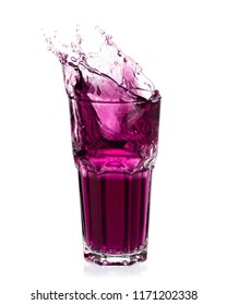 Grape Juice Splash Out Of Glass Isolated On White Background.