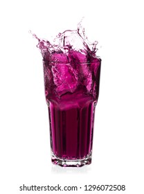 Grape Juice Splash Out Of Glass Isolated On White Background.