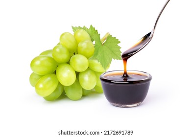 Grape Molasses In Glass Bowl And Bunch Of Green Grape With Leaf Isolated On White Background.