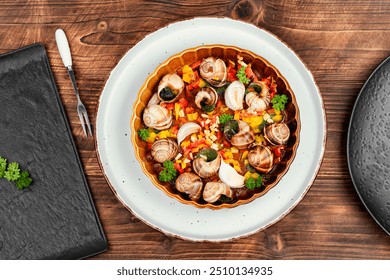 Grape snails stuffed with garlic butter on rustic wooden background. - Powered by Shutterstock