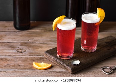 Grapefruit Or Cherry Radler, Citrus Beer Cocktail. Refreshing Fruit Beer Drink On Dark Table, Copy Space.