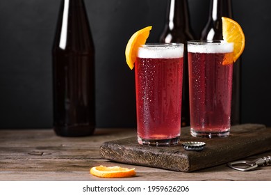 Grapefruit Or Cherry Radler, Citrus Beer Cocktail. Refreshing Fruit Beer Drink On Black Table, Copy Space.