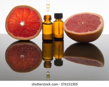 Grapefruit essential oil, grapefruit extract, essence, in amber glass bottle with dropper