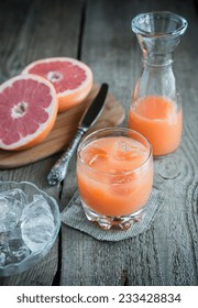 Grapefruit Juice On The Wooden Table