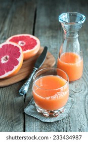 Grapefruit Juice On The Wooden Table