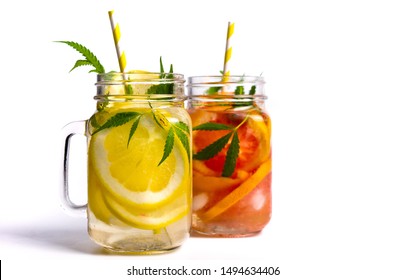 Grapefruit and lemon juice with marijuana in a glass isolated