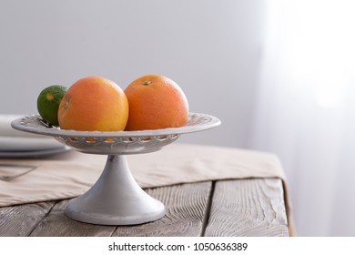 Grapefruit and lime on table, mint