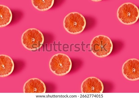 Grapefruit pattern on pink backround.Minimal flat lay concept