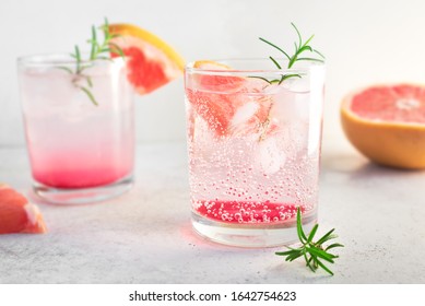 Grapefruit And Rosemary Cocktail, Refreshing Drink With Ice. Greyhound Cocktail, Citrus Sparkling Soft Drink, Close Up.