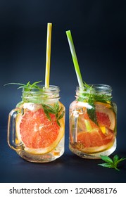 Grapefruit smoothie with marijuana leaves in jars