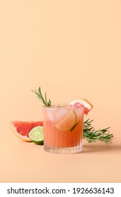 Grapefruit Soda With Lime Garnish Rosemary Sprig Isolated On Color Background. Mocktail Paloma. Close Up. Vertical Format.