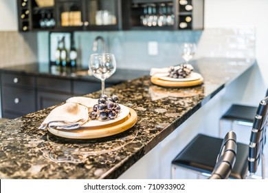 Grapes on plate of modern granite kitchen bar in luxury apartment or restaurant
