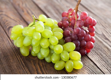 Grapes On A Wooden Table