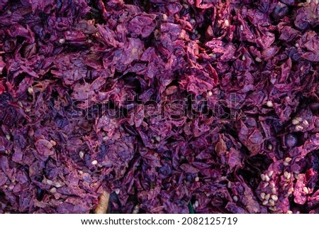 Grapes pomace background. Solid remains. Skins, pulp, and seeds. Wine-making process.