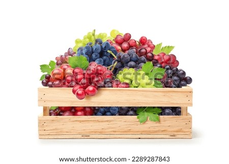 Grapes varieties in wooden crate isolated on white background. Clipping path.