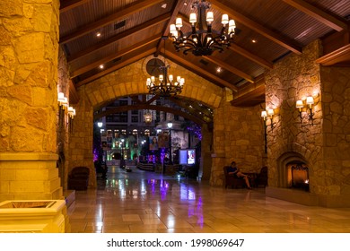 Grapevine, Texas, USA - June 15th, 2021:Gaylord Texan Resort Cozy Interior Lobby Design. People Relaxing Near The Fireplace