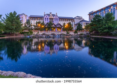 Grapevine, Texas, USA - June 15th, 2021: Beautiful Gaylord Texan Resort building over a stone bridge at twilight
