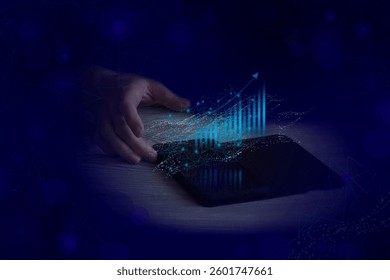 A graph of the growth of a successful business  data visualization on the screen of a gadget held by a person's hand.