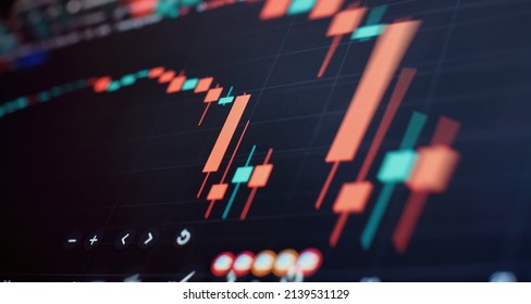 Graph And Indicator, Red And Green Candlestick Chart On Blue Theme Screen, Market Volatility, Up And Down Trend. Stock Trading, Crypto Currency Background.