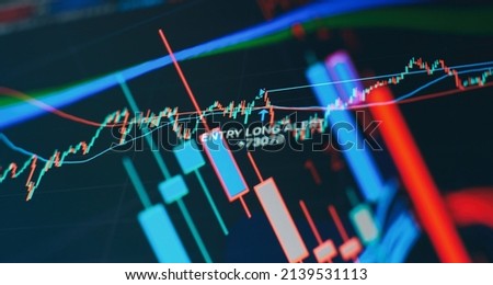 graph and indicator, red and green candlestick chart on blue theme screen, market volatility, up and down trend. Stock trading, crypto currency background.