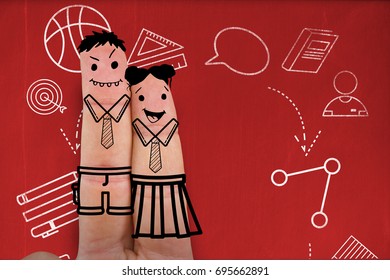 Graphic anthropomorphic smiley faces of friends on fingers against blackboard with copy space on wooden board