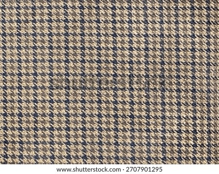 Graphic background of houndstooth pattern in brown and black color. Seamless background texture.