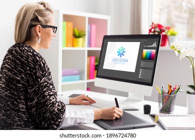 Graphic design artist working on client's logo design - Shutterstock ID 1896724780