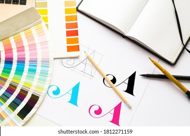 Graphic design logo composition with tools and color schemes