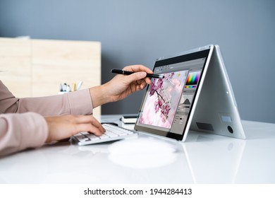 Graphic Designer Artist Drawing On Digital Tablet Or Hybrid Laptop