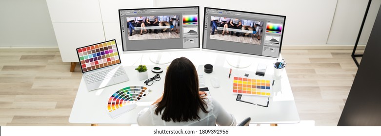 Graphic Designer Artist Working On Multiple Computer Screens - Shutterstock ID 1809392956