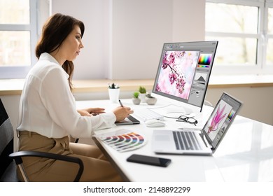 Graphic Designer Artist Working On Multiple Computer Screens