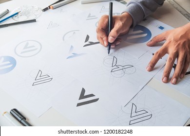 Graphic designer drawing draft Logo  - Shutterstock ID 1200182248