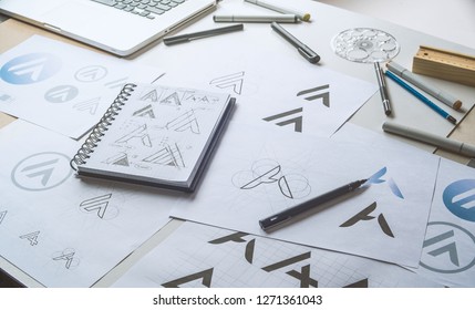 Graphic Designer Drawing Sketch Design Creative Ideas Draft Logo Product Trademark Label Brand Artwork. Graphic Designer Studio Concept.