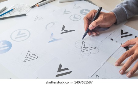 Graphic Designer Drawing Sketch Design Creative Ideas Draft Logo Product Trademark Label Brand Artwork. Graphic Designer Studio Concept.