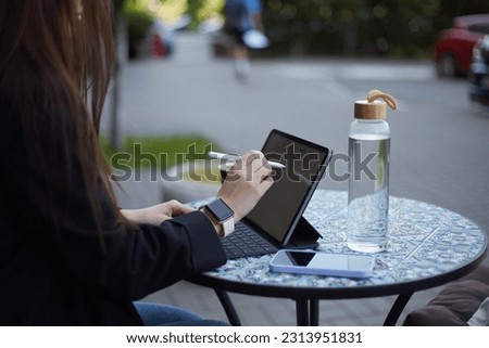 Graphic designer drawing a sketch on a tablet computer with stylus pen