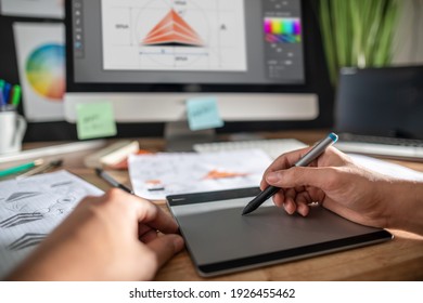 Graphic designer drawing sketches logo design. The concept of a new brand. Professional creative occupation with idea. - Shutterstock ID 1926455462