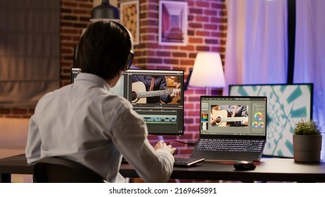 Graphic designer editing video montage on production software, working on computer to add visual effects and color gradient on footage. Edit creative multimedia film with sound. . - Shutterstock ID 2169645891