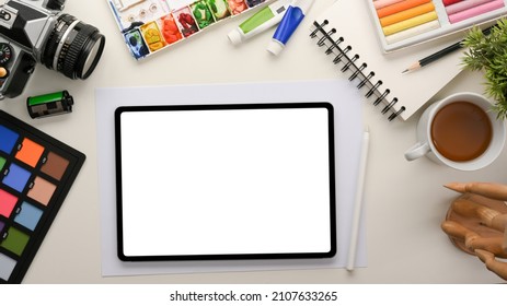 Graphic Designer Office Workstation With Work Equipment And Digital Tablet Computer White Display Mockup. Top View