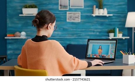 Graphic designer retouching picture for online editing class on laptop, using software to grade color for multimedia production. Photography student working to edit photos on computer. - Powered by Shutterstock