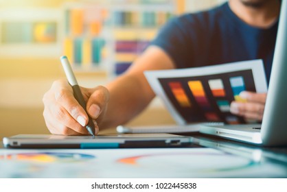 Graphic designer at studio work Creativity renovation and technology concept Color swatch samples for selection coloring on digital graphic tablet - Powered by Shutterstock