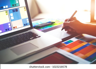 Graphic designer at studio work Creativity renovation and technology concept Color swatch samples for selection coloring on digital graphic tablet - Powered by Shutterstock