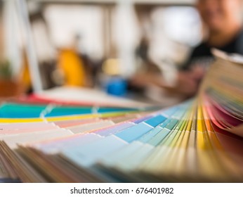 Graphic Designer Using Graphics Tablet To Do His Work At Desk