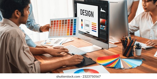 Graphic designer work on computer laptop and with graphic drawing pen while brainstorming unique design with professional graphic team in modern digital studio workplace. Panorama shot. Scrutinize - Powered by Shutterstock